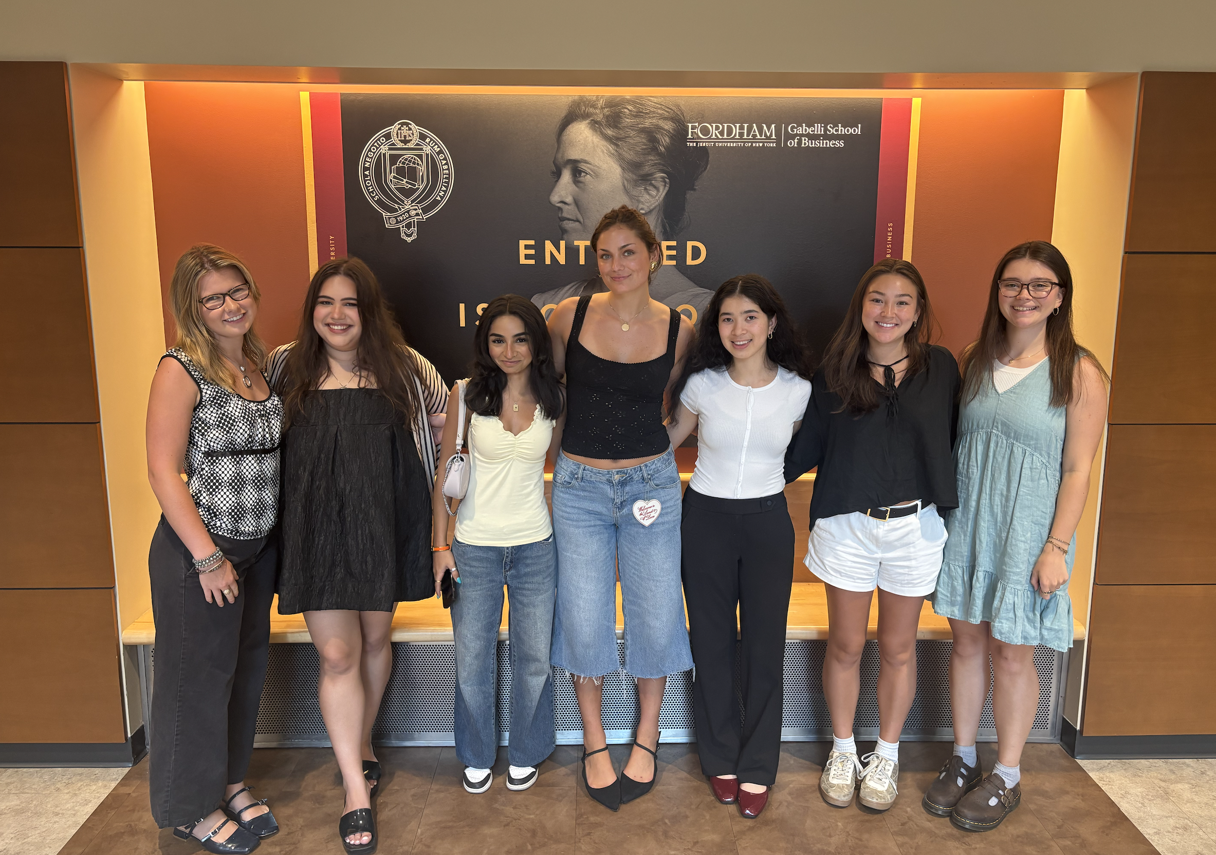 A group of young women pose for a photo 